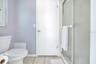 Primary water closet has pool access with shower and door that can be shut from the bedroom