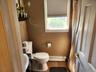 Bathroom with window and cellular shades