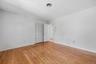 Bedroom 2 with hardwood floors