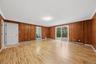 Enormous family room with new laminate floors and SGD to private backyard and patio