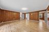 Enormous family room with new laminate floors and SGD to private backyard and patio