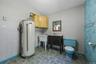 Laundry room with half bath and laundry tub