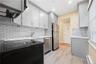 Kitchen has stainless steel appliances.