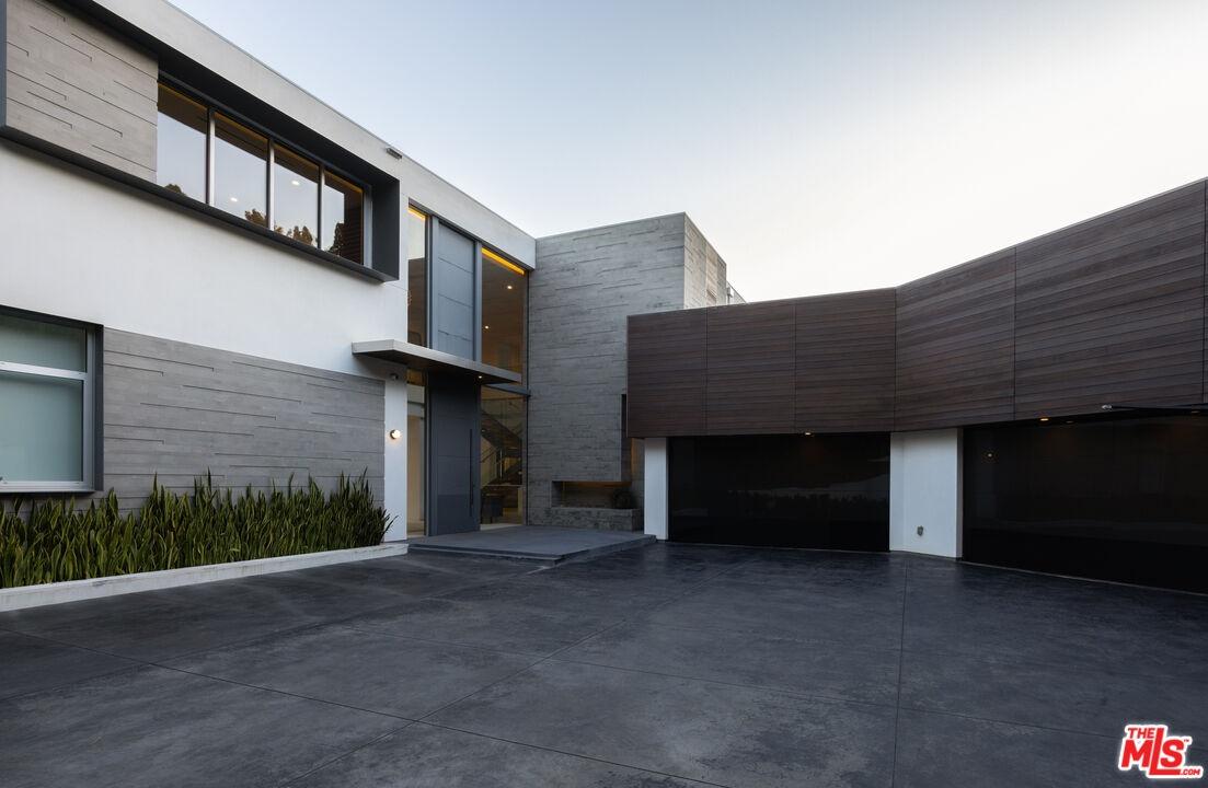 4 Car Garage with Uncovered Pa