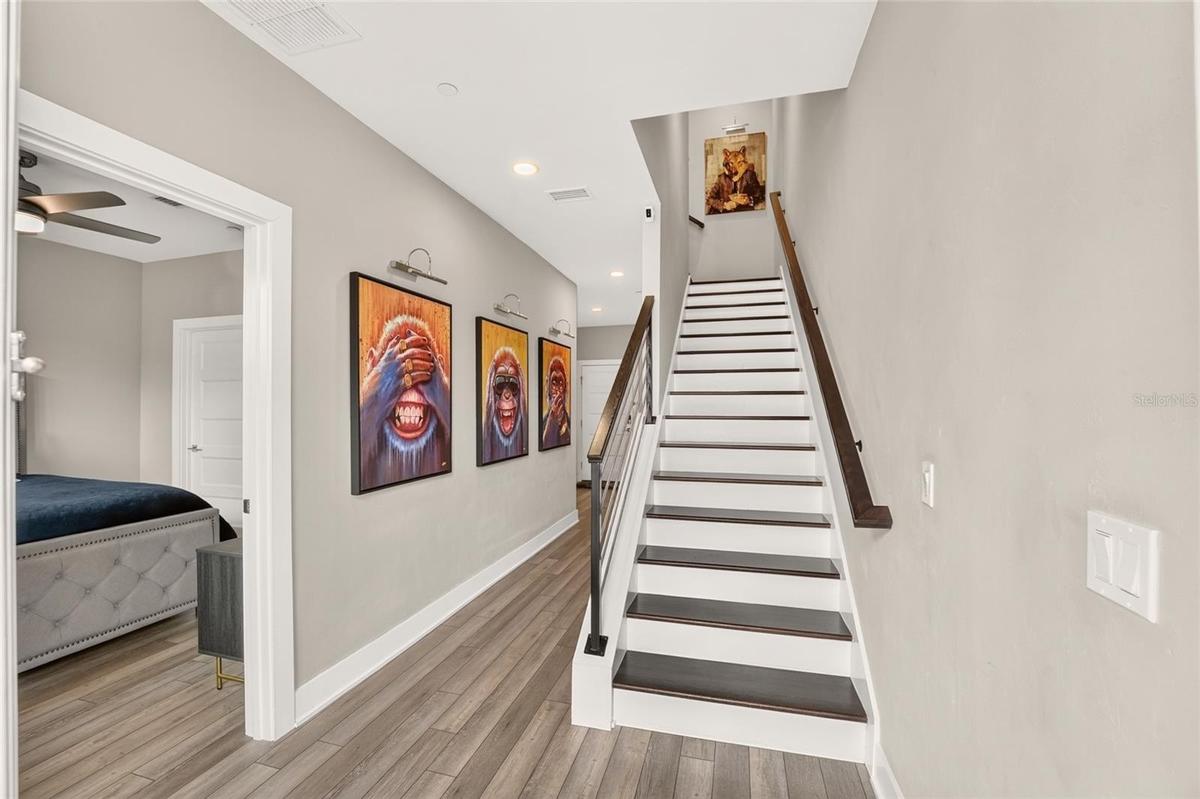 First floor entryway with bedroom, bathroom, laundry, and garage