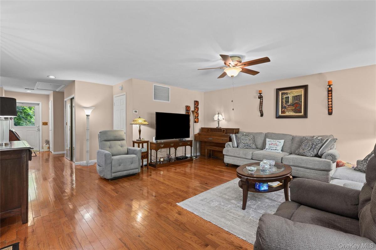 Living Room with view of entry door and hallway