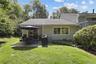 End unit providing level patio and room for barbecue