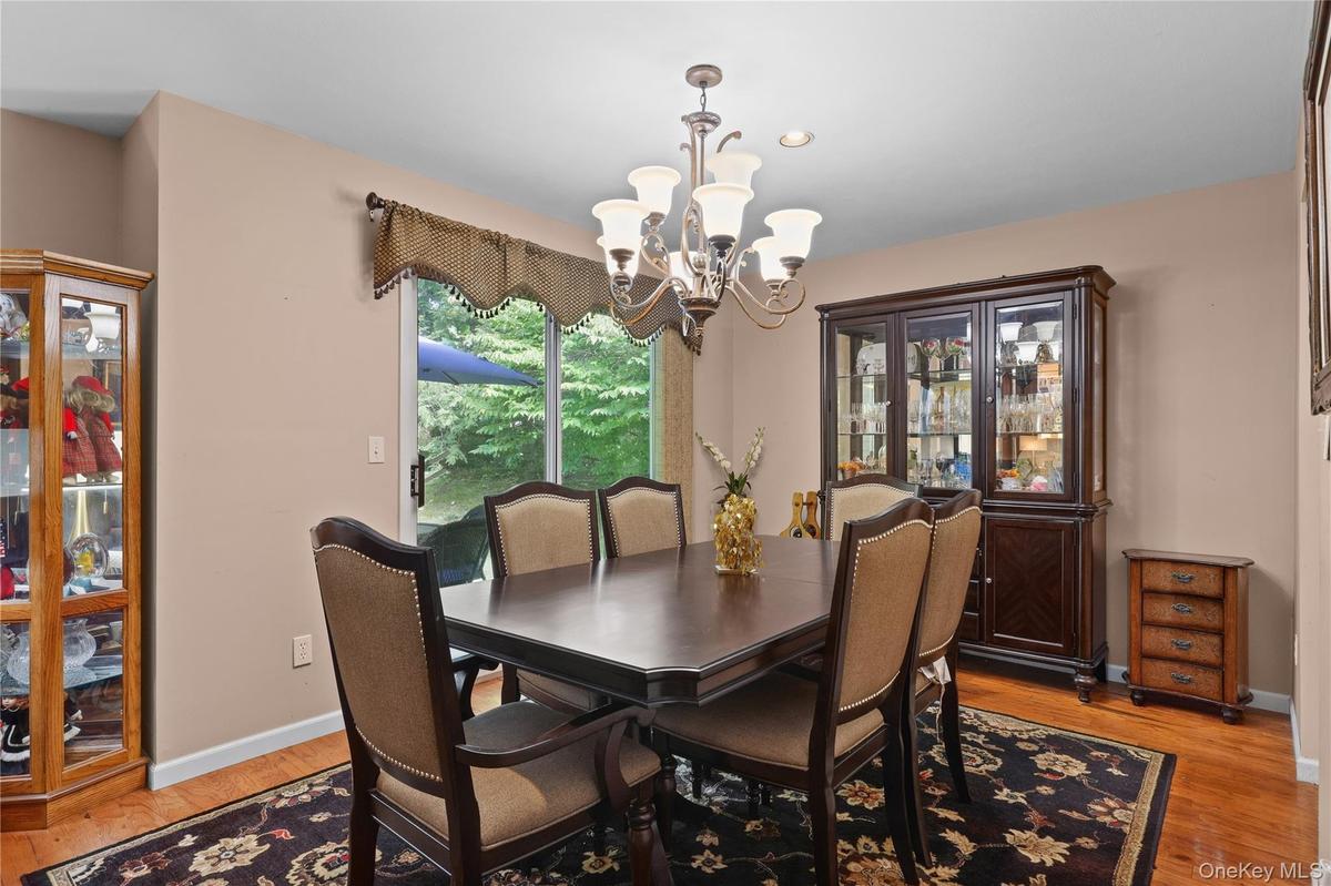 Dining Room with Sliding Glass door out to ground level patio.