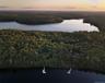 Aerial view at dusk of a water view and a view of trees