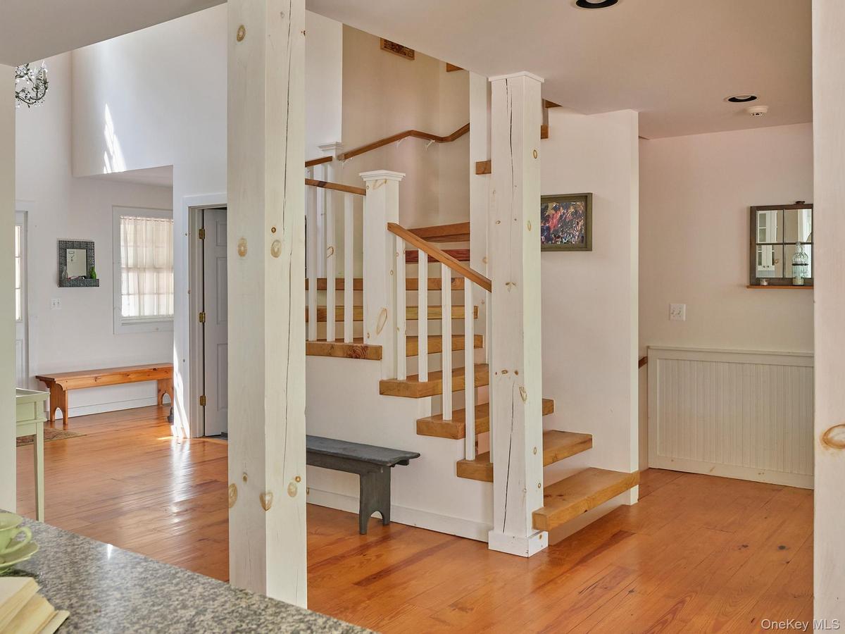 Staircase featuring wood-type flooring