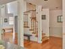 Staircase featuring wood-type flooring