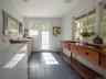 Entryway featuring tile patterned flooring and washing machine and dryer