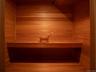 Relaxing sauna / steam room featuring wooden walls