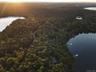 Aerial view at dusk of a water view and a view of trees