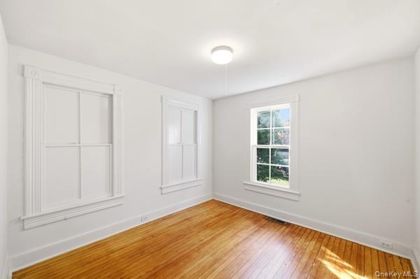 First room is living room or office space.Shuttered windows to porch