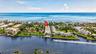 Waterfront property featuring direct ocean access, a bright blue ocean backdrop, and surrounded by canals