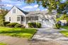 View of side of the home showing driveway and a one car garage