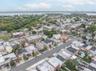 Aerial view of property and surrounding area with a large body of water