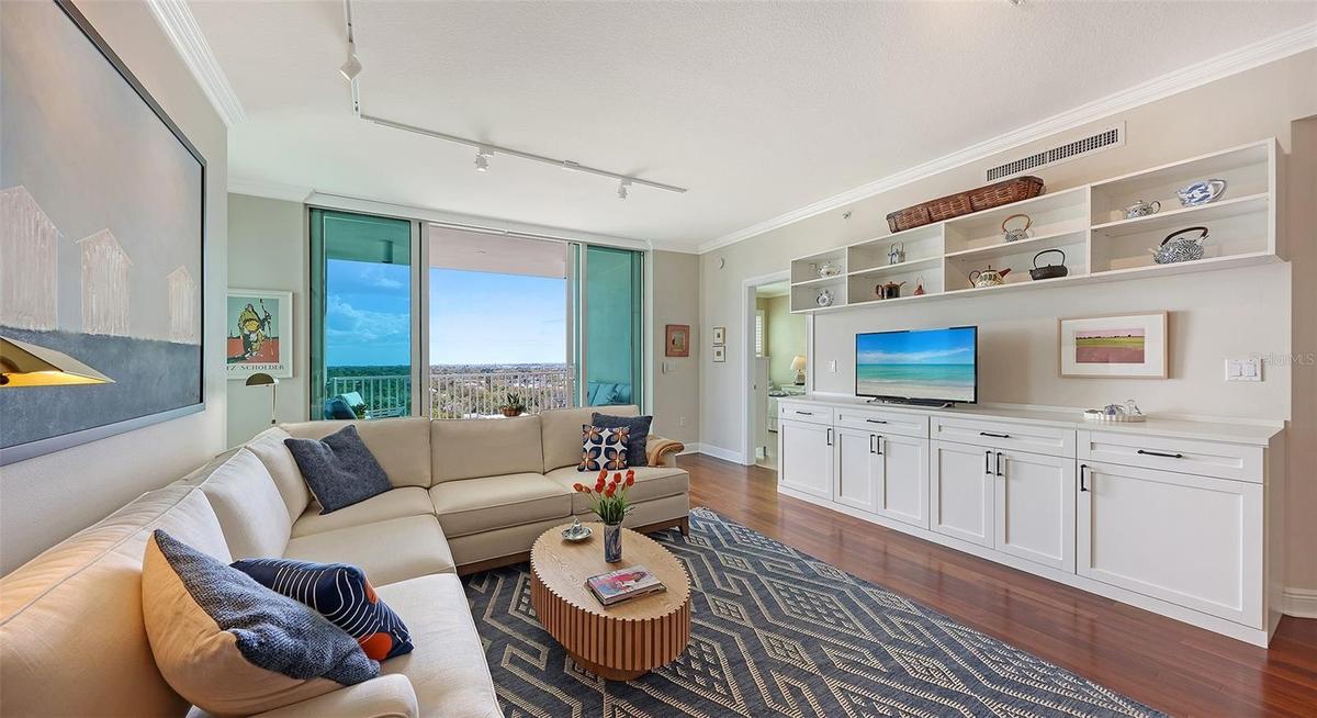 Living Room with Ceiling Height Wall of Sliders