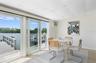 Flex Florida room features hurricane sliding glass doors. Remote Shades, too