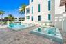 221 Shore Ct Community Pool. A remarkable luxury townhome rental that redefines upscale living in the heart of Lauderdale By The Sea. This beautifully