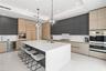 A custom designer kitchen with top of the line appliances, huge island, and tons of cabinetry storage. A remarkable luxury townhome rental that redefi