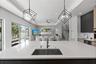 A custom designer kitchen with top of the line appliances, huge island, and tons of cabinetry storage. A remarkable luxury townhome rental that redefi