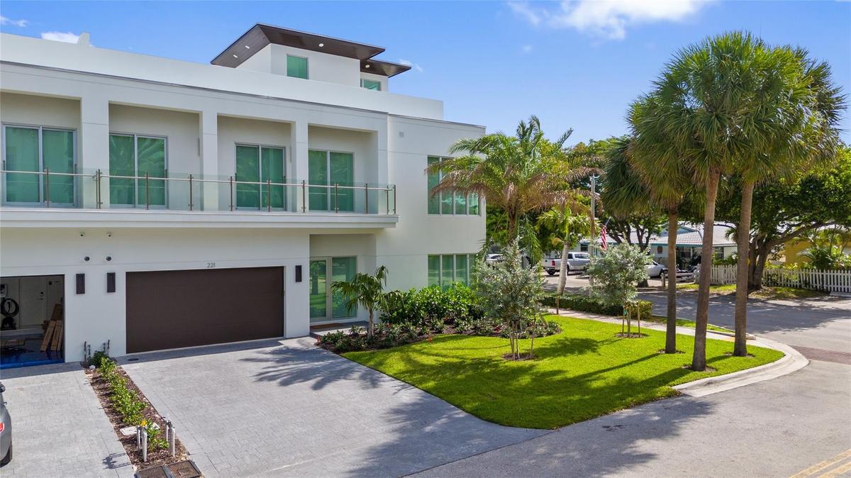 Front View - A remarkable luxury townhome rental that redefines upscale living in the heart of Lauderdale By The Sea. This beautifully designed 3,027 