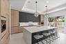 A custom designer kitchen with top of the line appliances, huge island, and tons of cabinetry storage. A remarkable luxury townhome rental that redefi