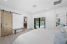 LARGE MAIN BEDROOM WITH SLIDING BARN DOOR