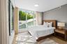 Guest bedroom with abundant natural light and clean aesthetic — perfect Miami Beach getaway space.