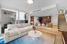 Spacious living area with clean lines, recessed lighting, and open flow to dining and kitchen — perfect for entertaining.