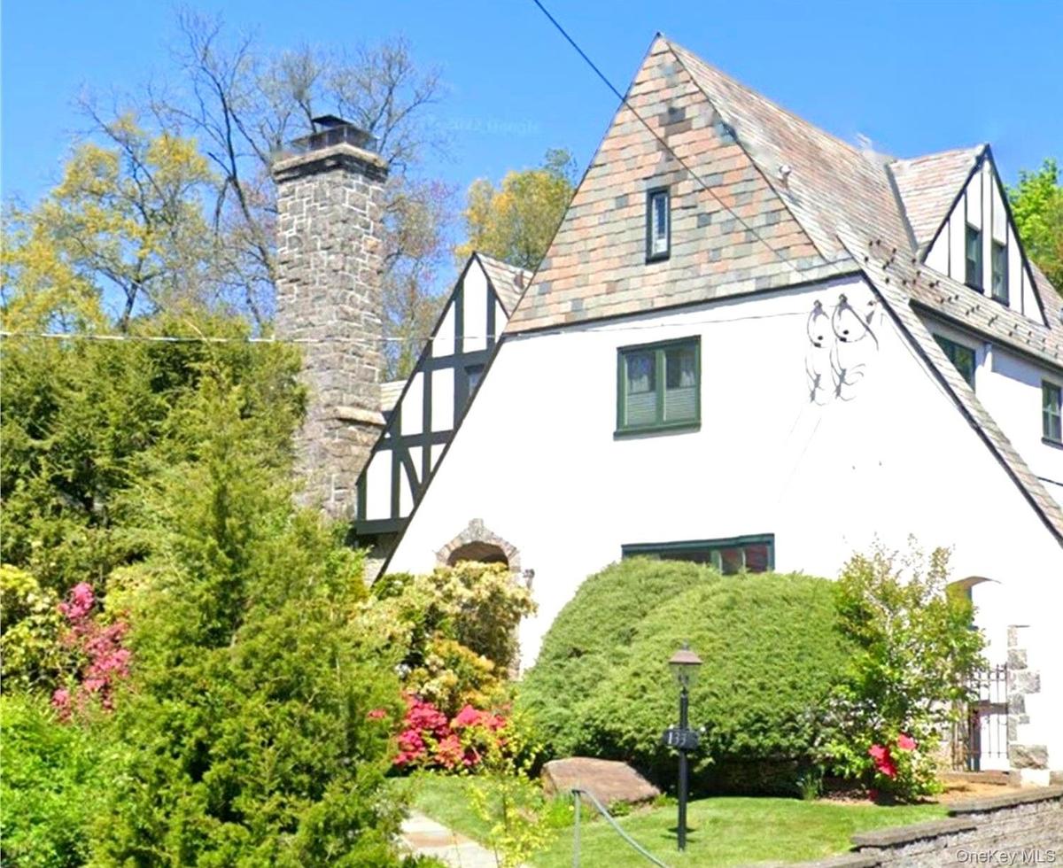 Offered for the first time in over 20 years, 133 Bon Air Avenue is a timeless Tudor distinguished by its iconic stone chimney, classic architecture, a