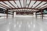 Garage building offering separation of use and expanded storage capability.