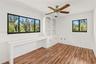 Comfortable guest bedroom offering a peaceful retreat with a functional layout and natural light.