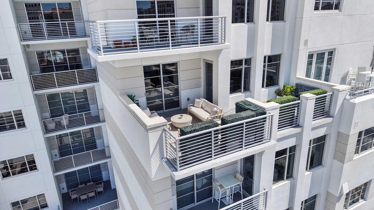 Residence 601 at Tower 155 is distinguished by approximately 428 square feet of outdoor living across two private spaces. VIRTUALLY ADJUSTED.