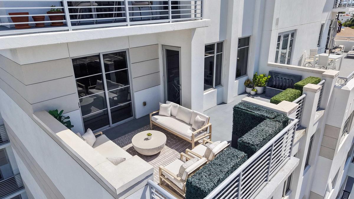 The oversized south-facing terrace connects directly to the main living space at Residence 601. VIRTUALLY ADJUSTED.