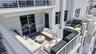 The oversized south-facing terrace connects directly to the main living space at Residence 601. VIRTUALLY ADJUSTED.