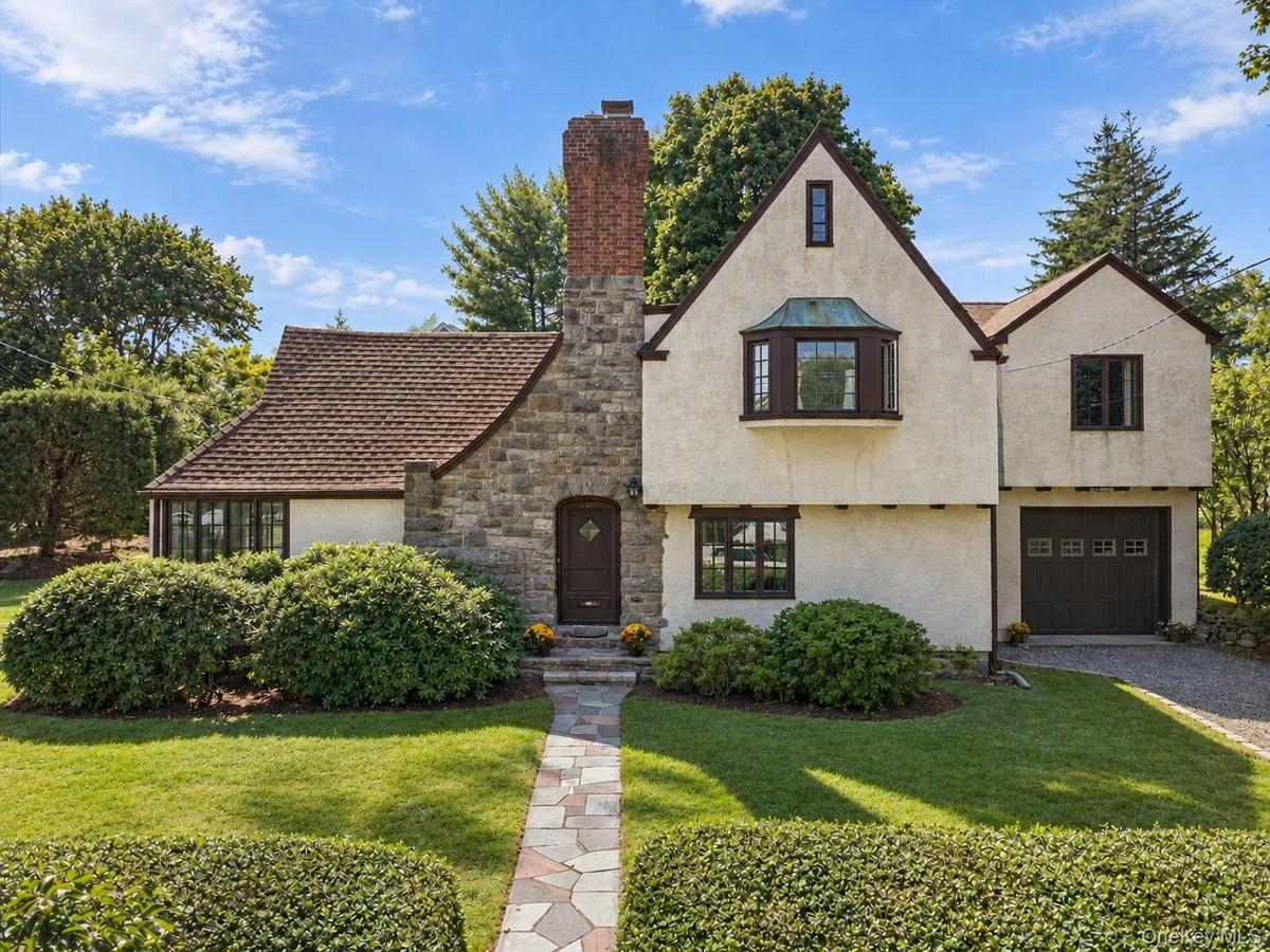 Classic Tudor charm meets an easy, flexible layout in this character-filled Harbor Heights home.