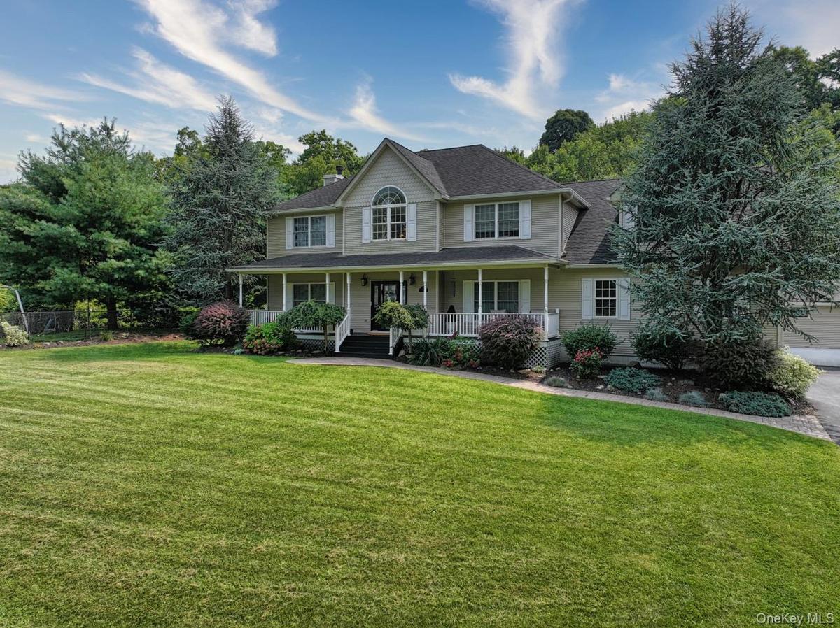 A beautiful home, this photo BEFORE the brand new path, new front staircase, and freshly trimmed specimen trees.t