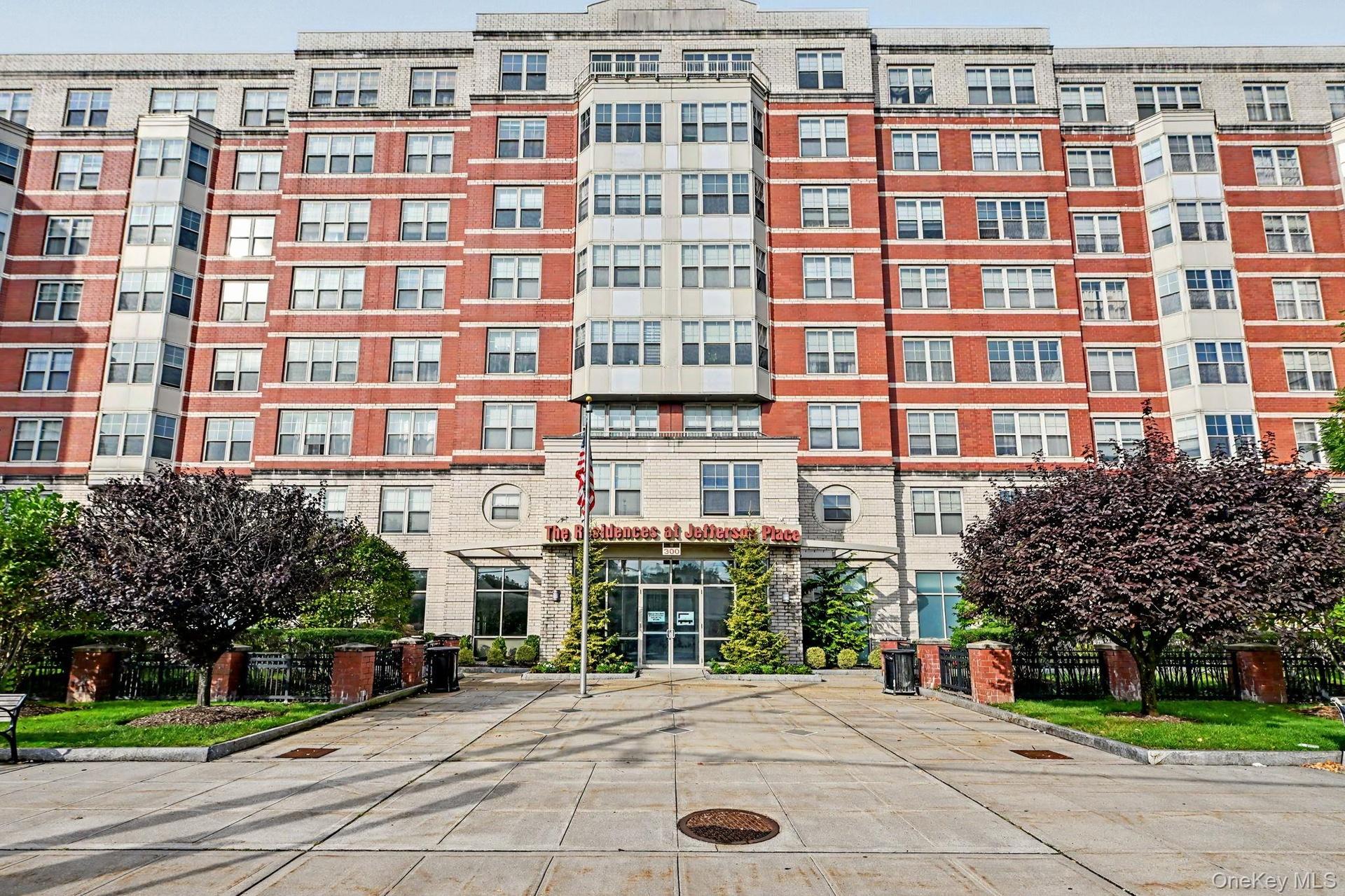 300 Mamaroneck Ave side of the building. Brick facade,