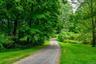 Long private driveway leads to home