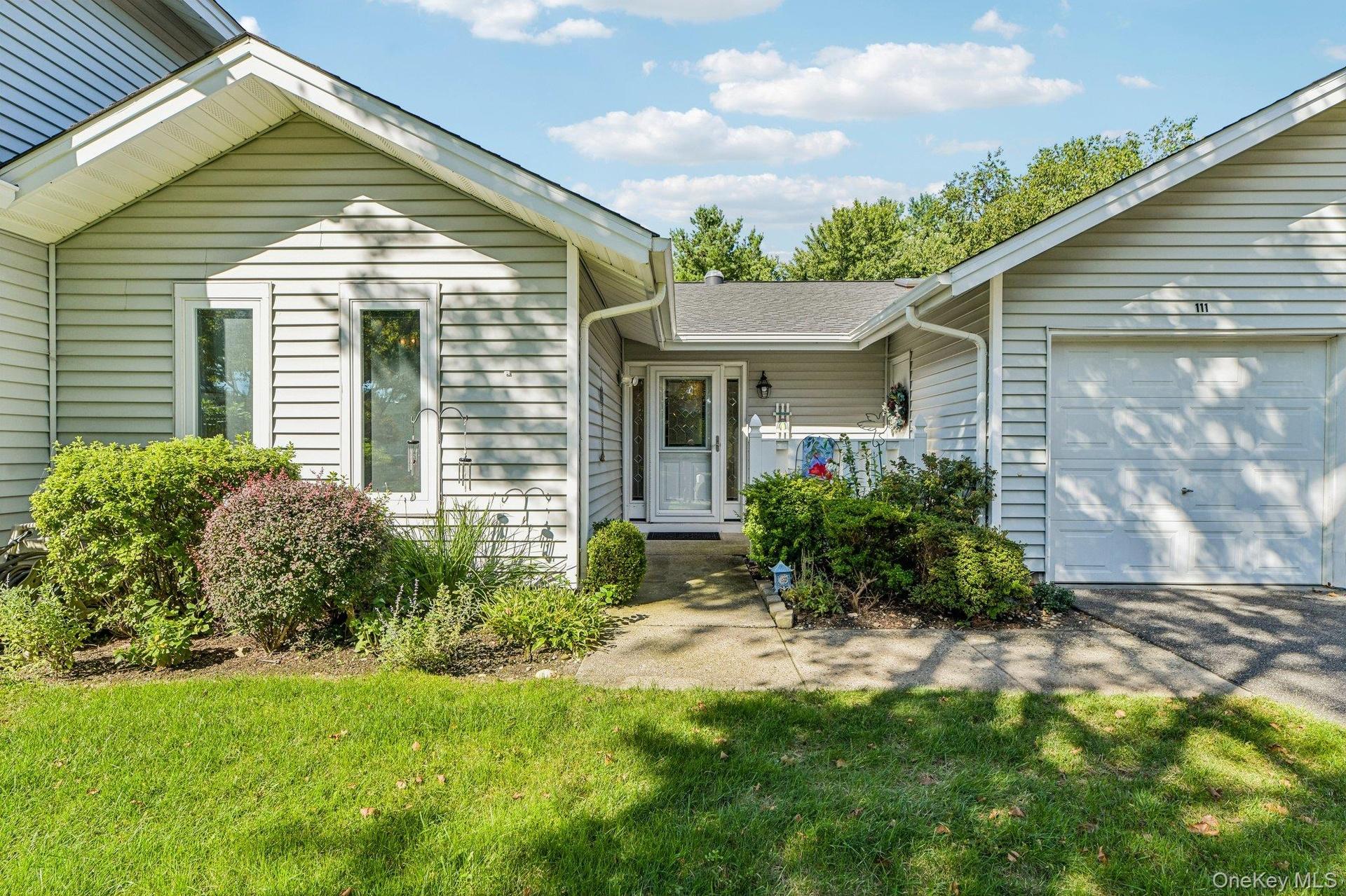 Ranch style condo with attached one car garage