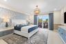 Beautifully decorated Primary suite with balcony access