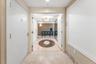 Double entryway makes an open and dramatic entrance to the home