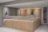 Reception desk featuring wood-paneled cabinetry, a stone-surfaced countertop, integrated under-counter lighting, and a vertical wood slat accent wall 
