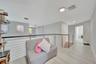 Open area featuring wood-finish flooring, metal cable railing, and recessed ceiling lighting