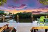 Waterfront dock featuring composite decking, integrated perimeter lighting, and decorative pilings