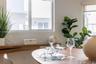 Horizontal sliding windows, built-in wood-finish shelving, and integrated roller shades