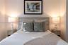 Horizontal wood-finish headboard featuring clean lines and neutral tones